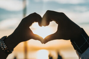 two hands making a heart