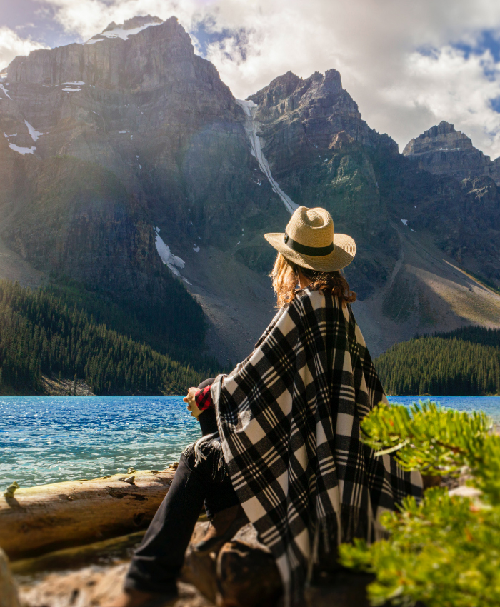 woman overlooking a lake and mountains