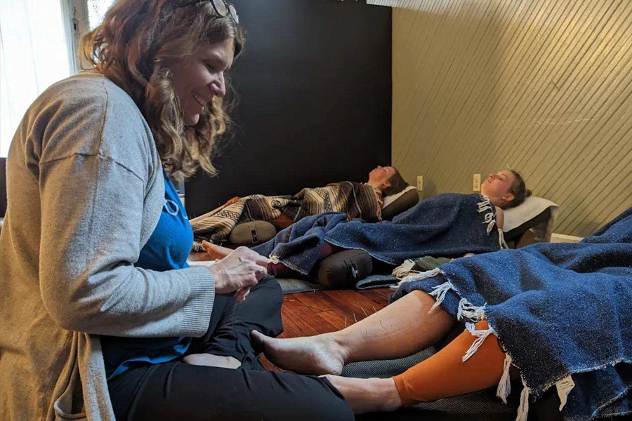 Leslie performing acupuncture