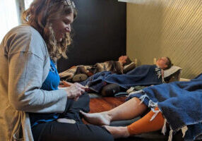 Leslie performing acupuncture